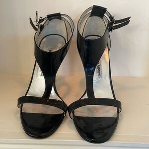 Manolo Blahnik black patent strappy stilettos.